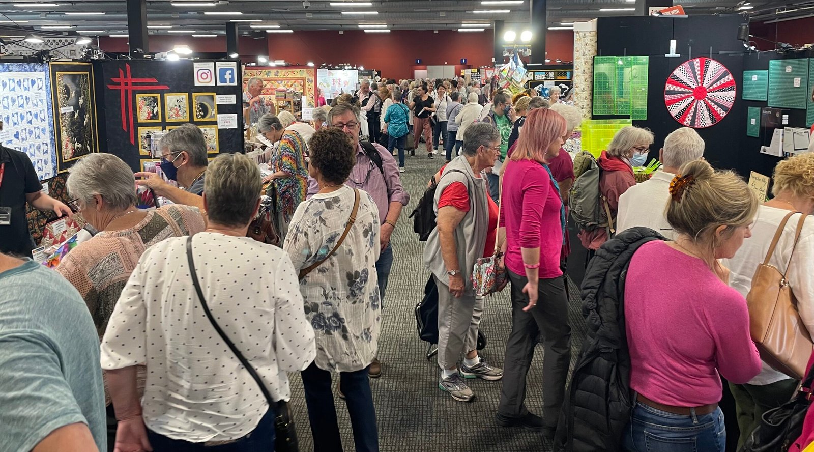 QuiltNSW_Busy-aisle-scaled-e1680592328245